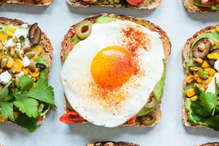 Avocado Toasts with Fried Egg, Olives and Smoked Paprika